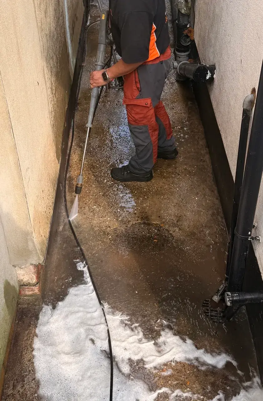 Alley being pressure washed by WrXperts