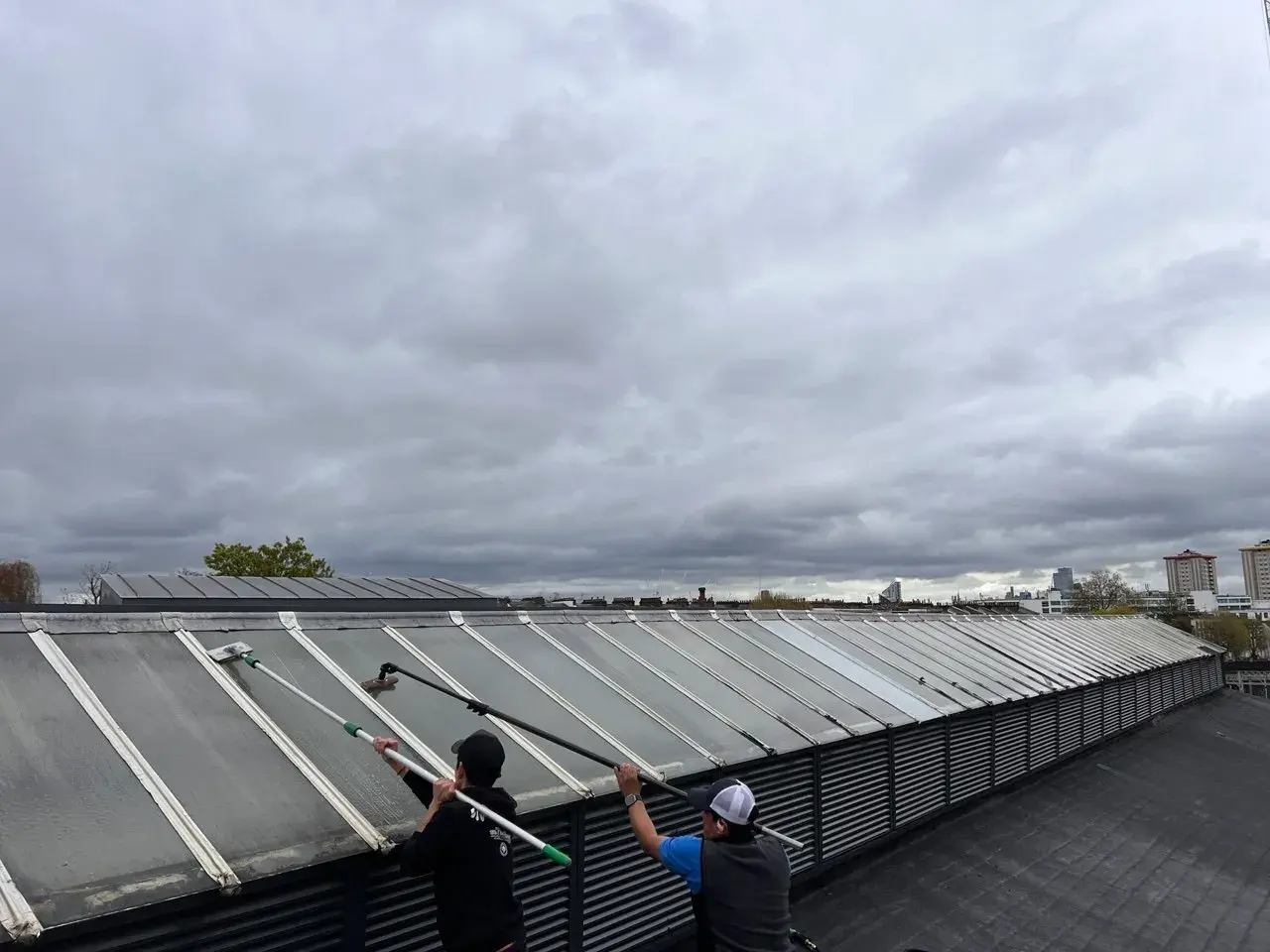 Commercial roof skylight cleaning in progress