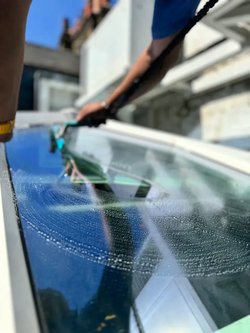 Close up of a squeegee finishing a skylight