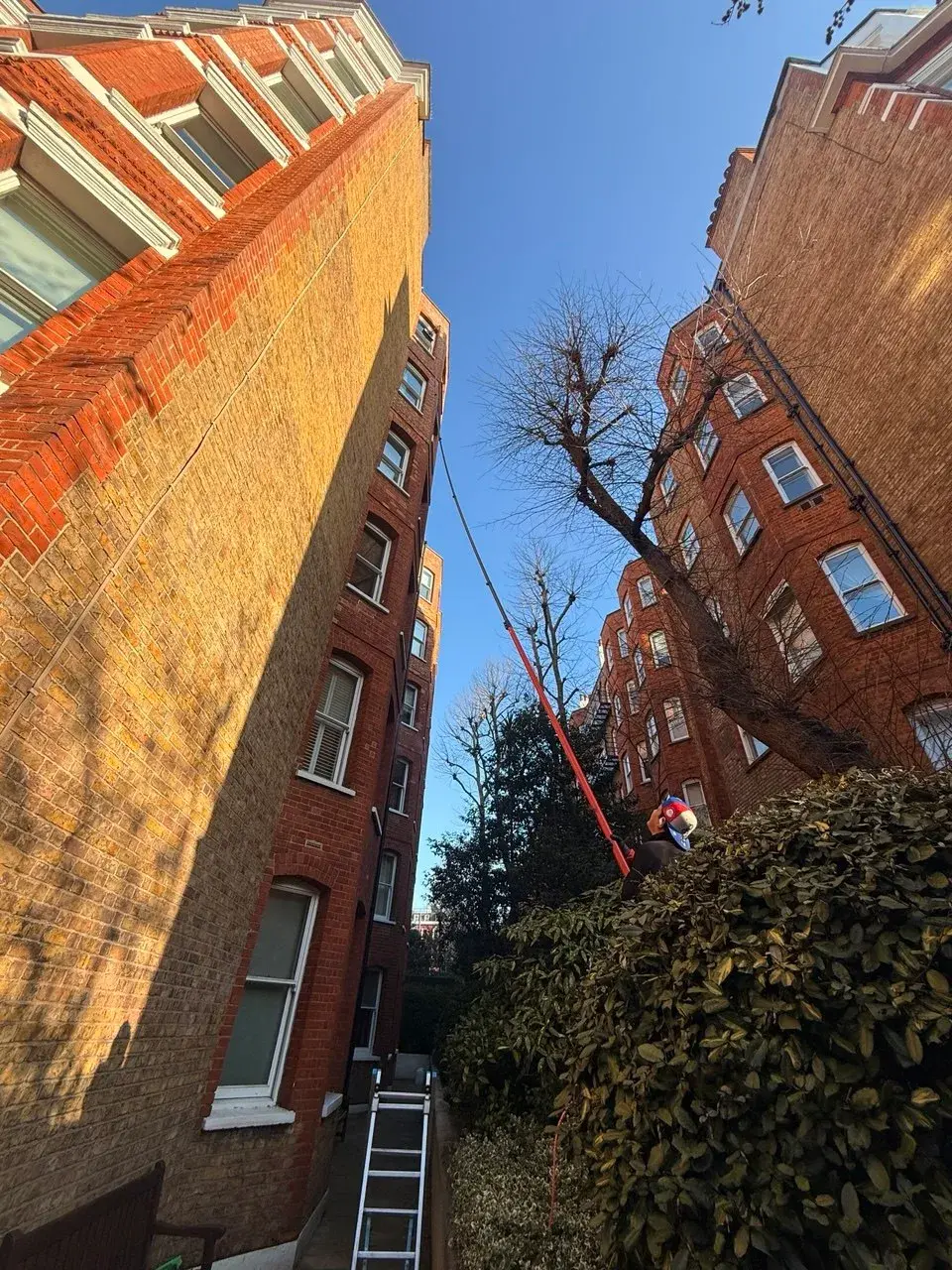 Window cleaning between two London buildings